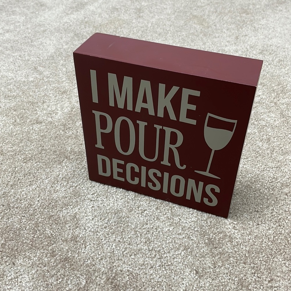 Red Decorative Sign with Humorous Quote